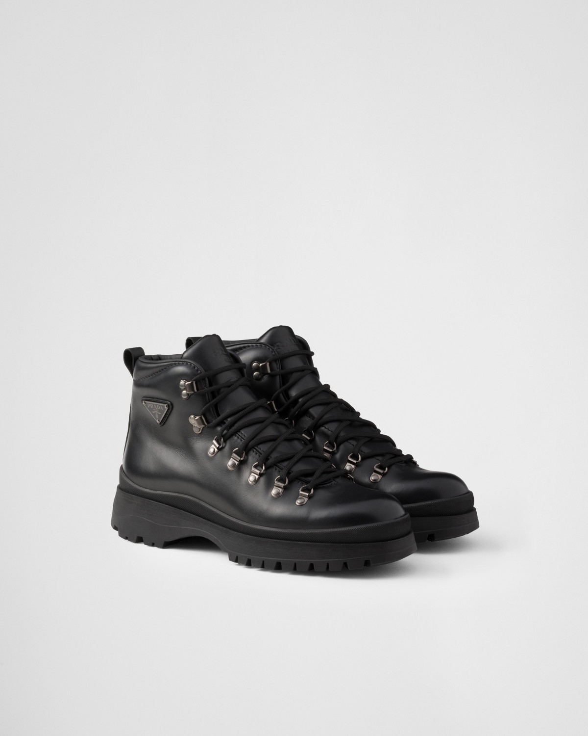 Prada Brixxen Leather Booties Black