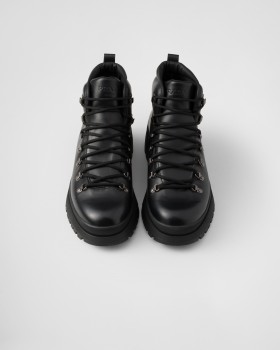 Prada Brixxen Leather Booties Black