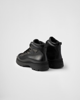 Prada Brixxen Leather Booties Black