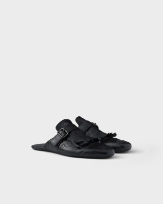 Prada Shuffle Antiqued Leather Mules With Buckled Strap And Fringe Black