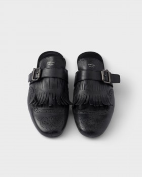Prada Shuffle Antiqued Leather Mules With Buckled Strap And Fringe Black