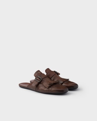 Prada Shuffle Antiqued Leather Mules With Buckled Strap And Fringe Cognac