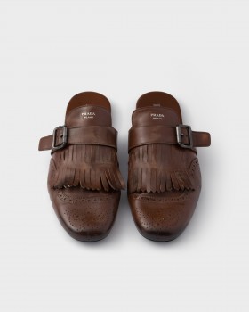 Prada Shuffle Antiqued Leather Mules With Buckled Strap And Fringe Cognac
